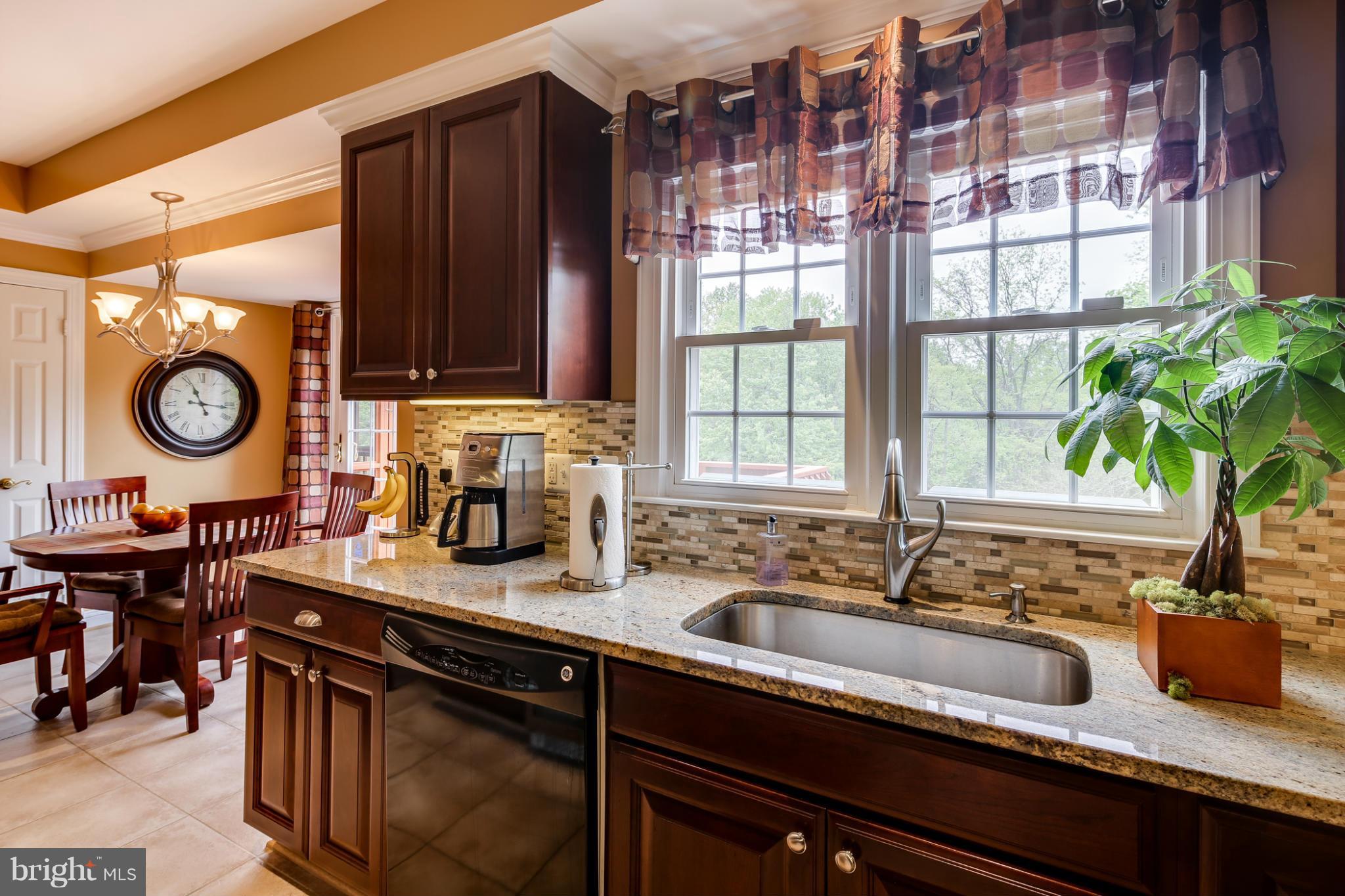 14608 Cutstone Way Silver Spring, MD 20905 - Photo 8 of 30 a kitchen with a sink and a window
