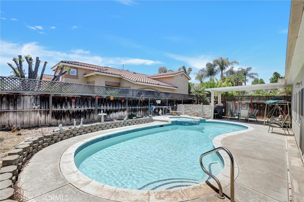 20895 Parish Place Riverside, CA 92508 - Photo 5 of 18 an outdoor space with swimming pool and furniture