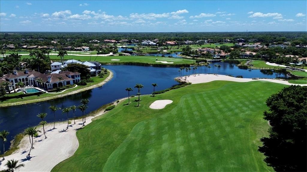 2220 Residence Circle Naples, FL 34105 - Photo 42 of 50 a view of a lake with houses