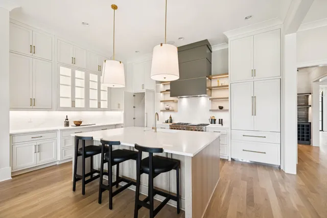 a kitchen with cabinets and white appliances