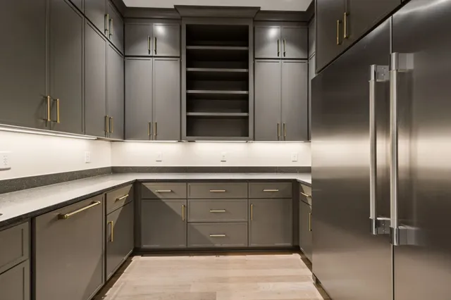 a view of a room with wooden floor and windows