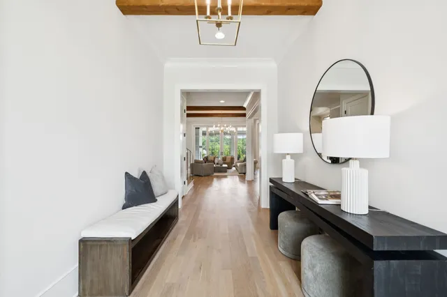 a living room with furniture cabinets and a fireplace