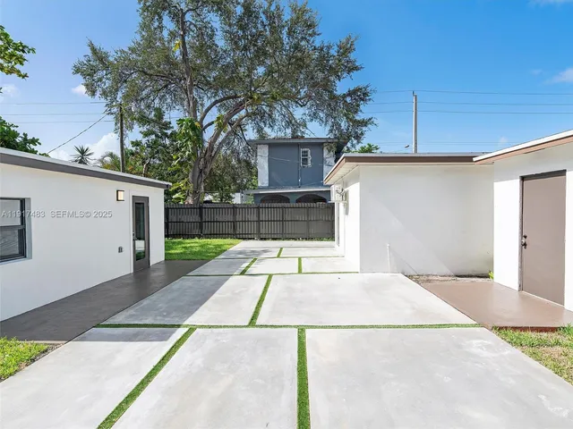 a view of a backyard of the house