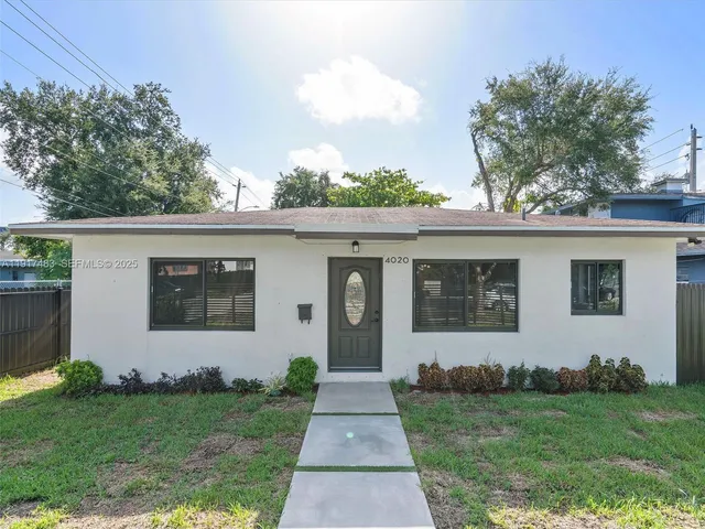 front view of a house with a yard