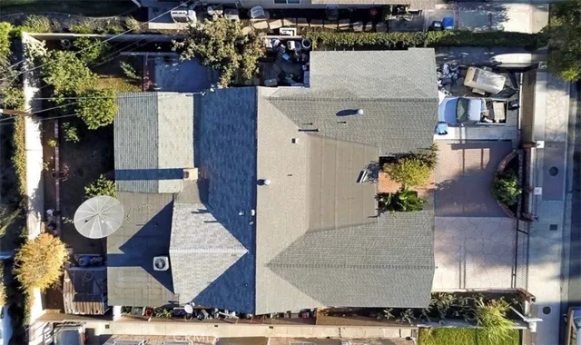 an aerial view of a house with outdoor space