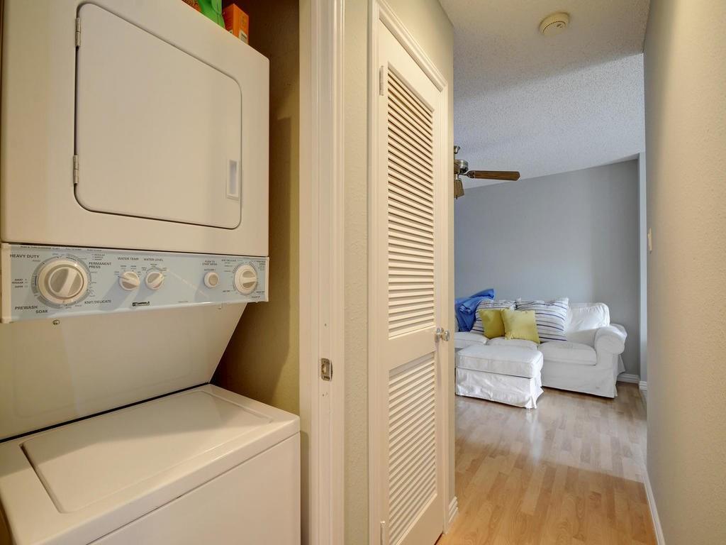 2409 Leon Street, Unit 207 Austin, TX 78705 - Photo 15 of 18 a view of washer and dryer with bathroom in the background