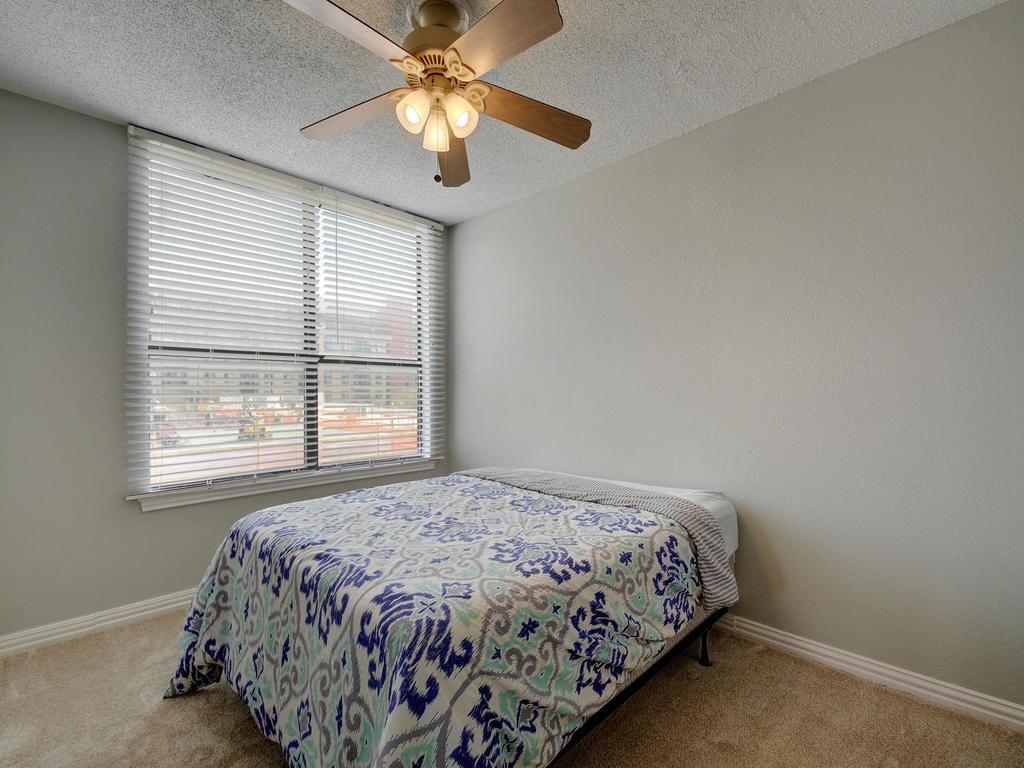 2409 Leon Street, Unit 207 Austin, TX 78705 - Photo 18 of 18 a bedroom with a bed and a window
