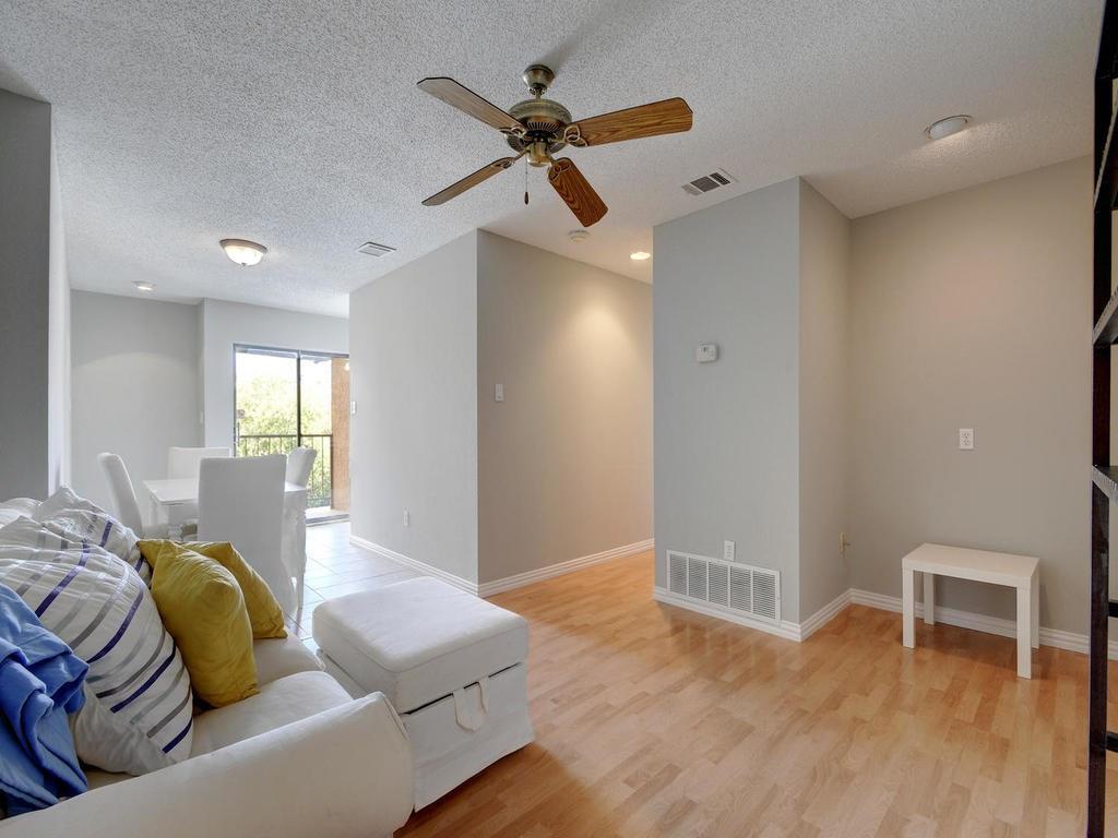 2409 Leon Street, Unit 207 Austin, TX 78705 - Photo 7 of 18 a living room with furniture and a window