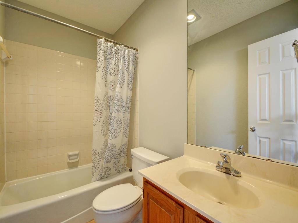 2409 Leon Street, Unit 207 Austin, TX 78705 - Photo 10 of 18 a bathroom with a sink toilet and shower