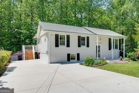 a front view of a house with yard
