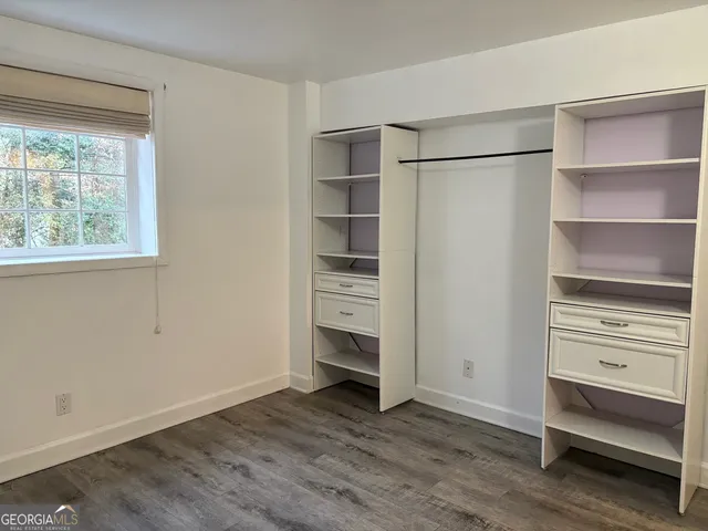 a bathroom with a shower and toilet