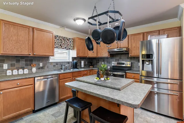 $329,000 | 12 Checkerberry Square, Unit 106, Milton, VT 05468