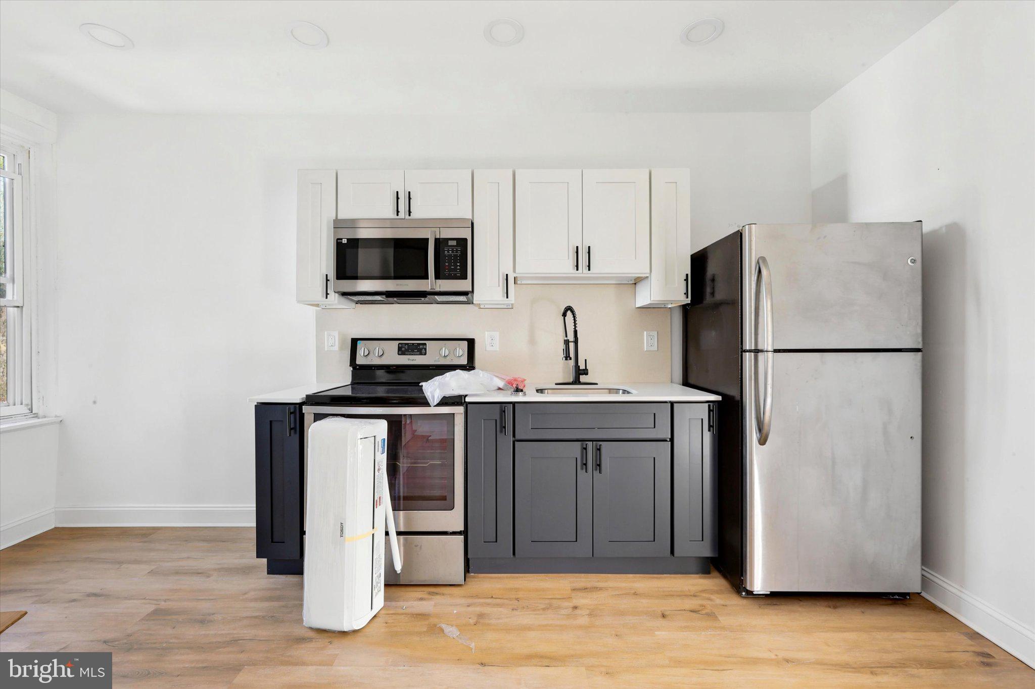 2046 South Norwood Street, Unit 2 Philadelphia, PA 19145 - Photo 12 of 17 Modern kitchen with sleek finishes.