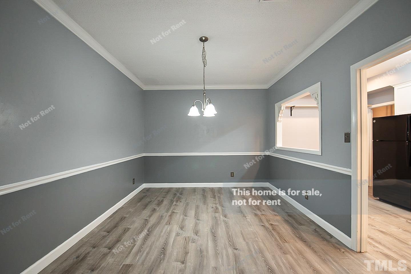 6335 New Market Way, Unit 1 Raleigh, NC 27615 - Photo 12 of 22 a view of a room with wooden floor fan and window