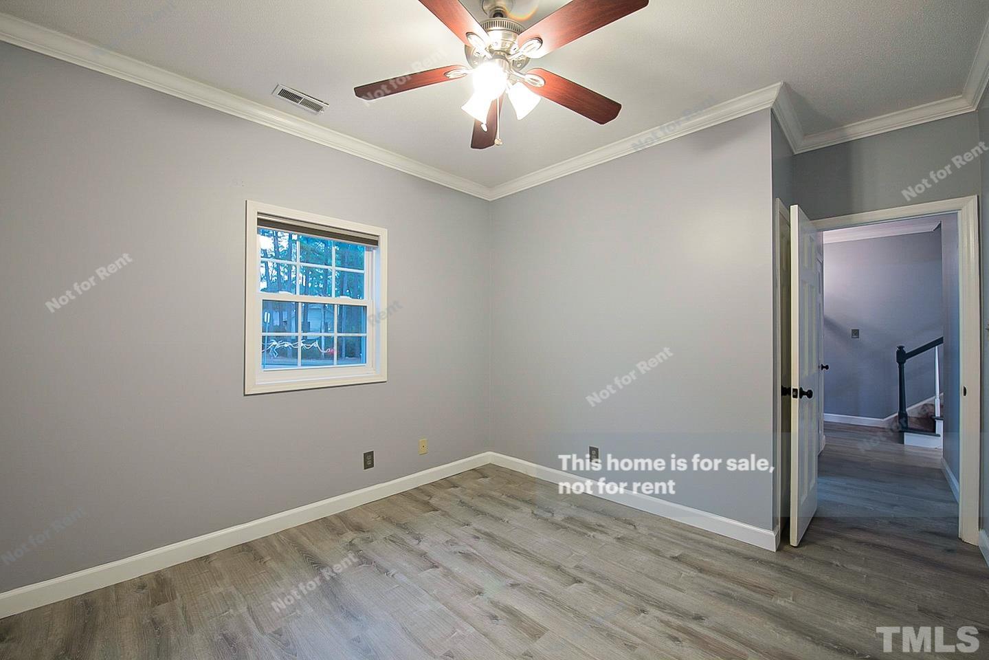 6335 New Market Way, Unit 1 Raleigh, NC 27615 - Photo 14 of 22 a view of a livingroom with a workspace