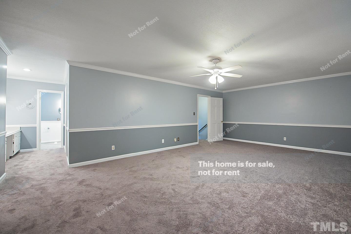 6335 New Market Way, Unit 1 Raleigh, NC 27615 - Photo 16 of 22 a view of an empty room with a ceiling fan