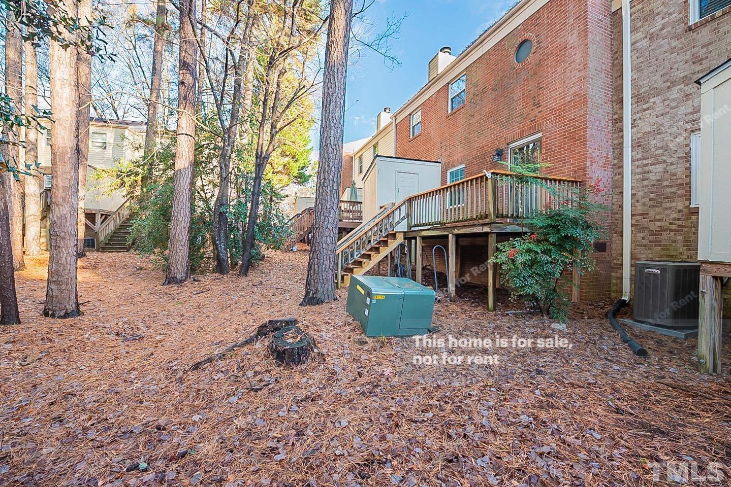 6335 New Market Way, Unit 1 Raleigh, NC 27615 - Photo 22 of 22 a view of a house with a yard