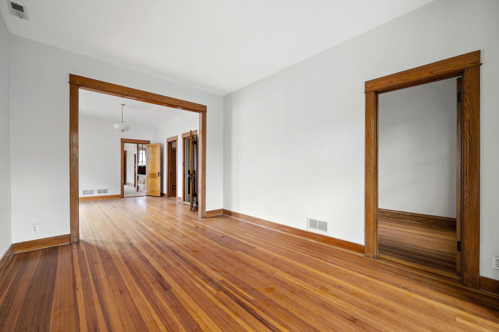 1415 West George Street Chicago, IL 60657 - Photo 14 of 35 a view of empty room with wooden floor and fan