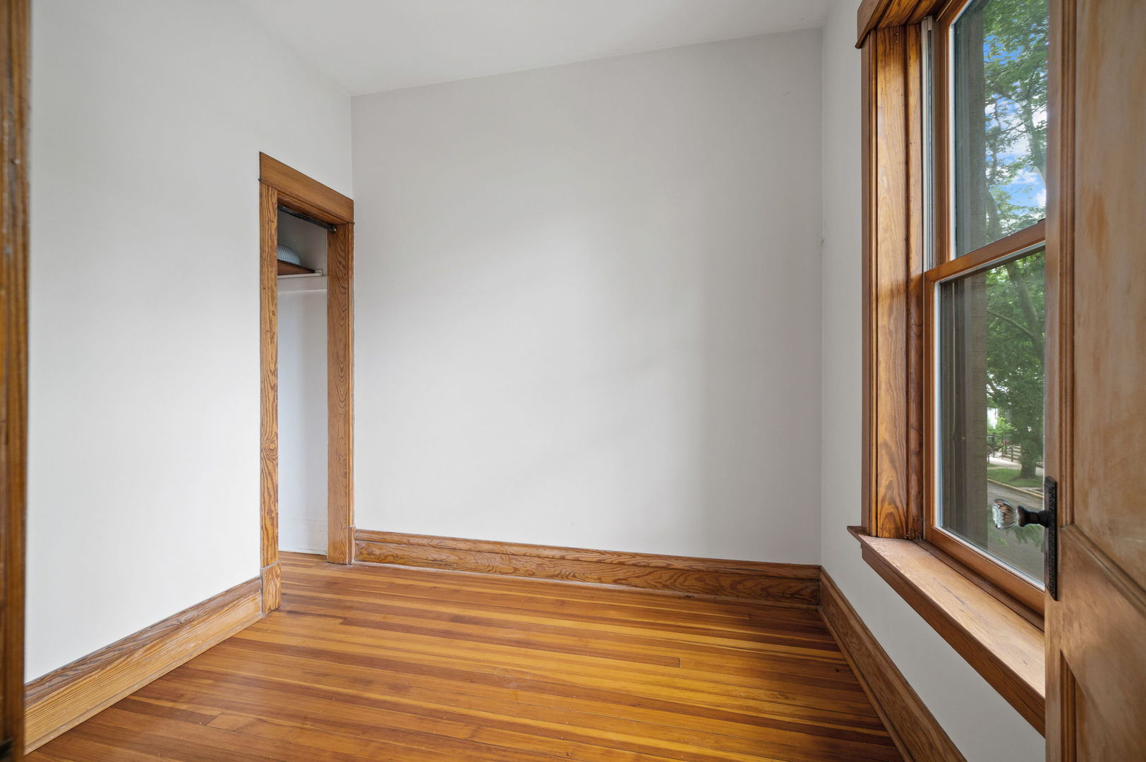 1415 West George Street Chicago, IL 60657 - Photo 15 of 35 a view of a small space with wooden floor and a window
