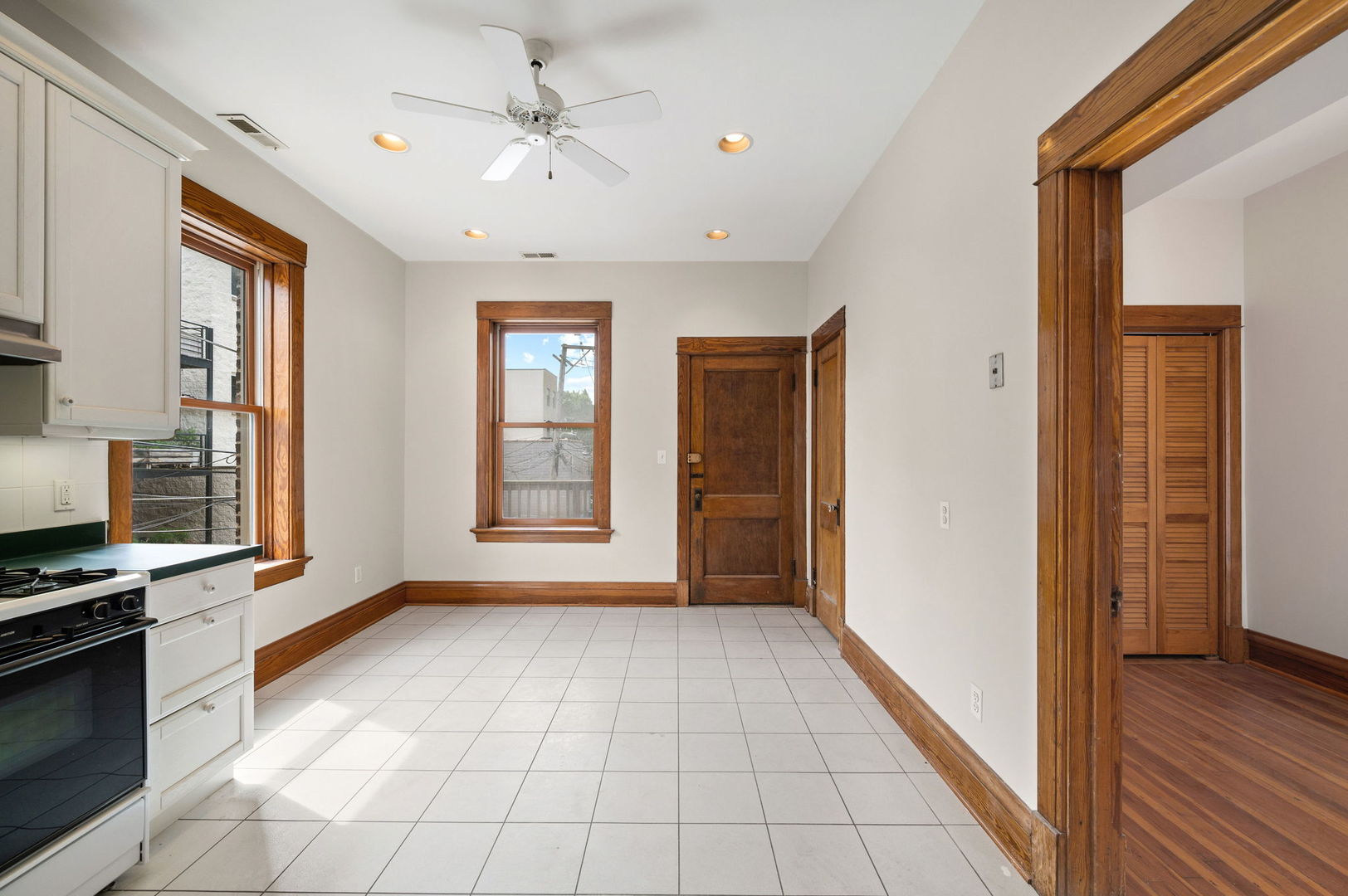 1415 West George Street Chicago, IL 60657 - Photo 19 of 35 a view of an empty room with window and wooden floor