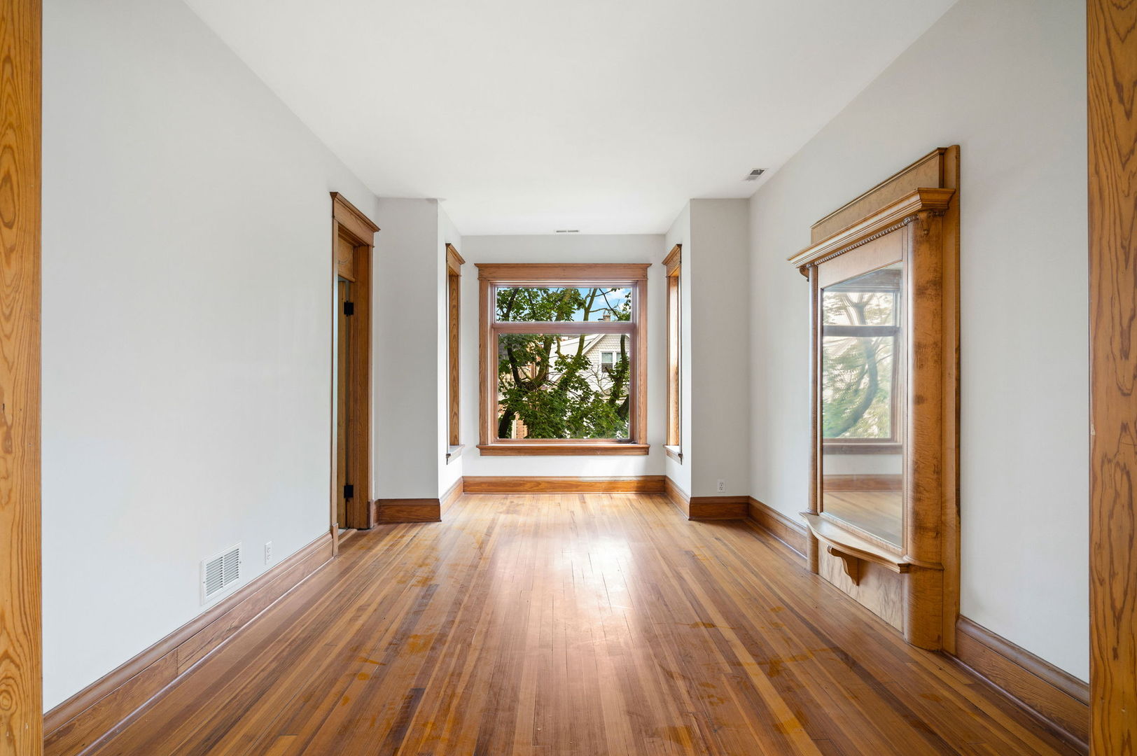 1415 West George Street Chicago, IL 60657 - Photo 22 of 35 a view of hallway with a large window and wooden floor