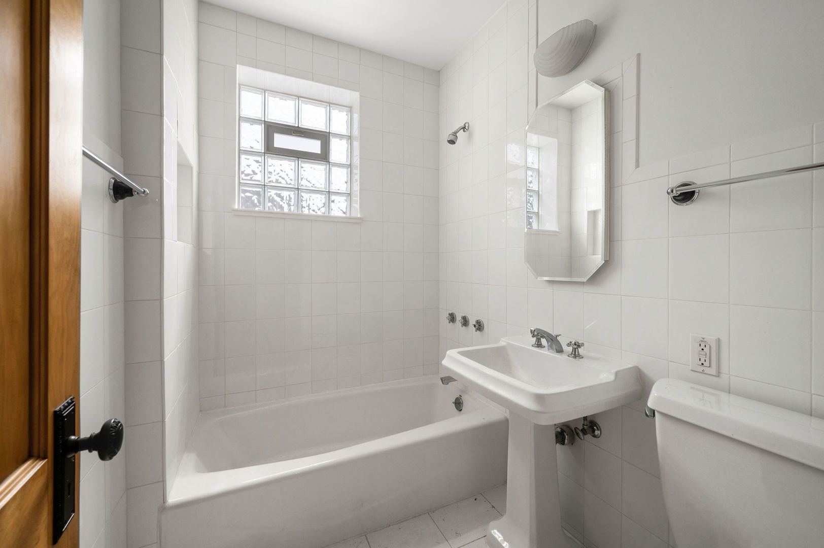 1415 West George Street Chicago, IL 60657 - Photo 29 of 35 a white bath tub sitting next to a white sink