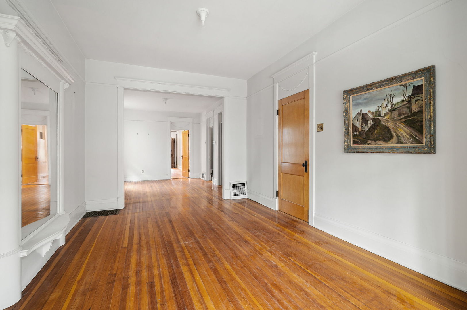 1415 West George Street Chicago, IL 60657 - Photo 5 of 35 an empty room with wooden floor and a window