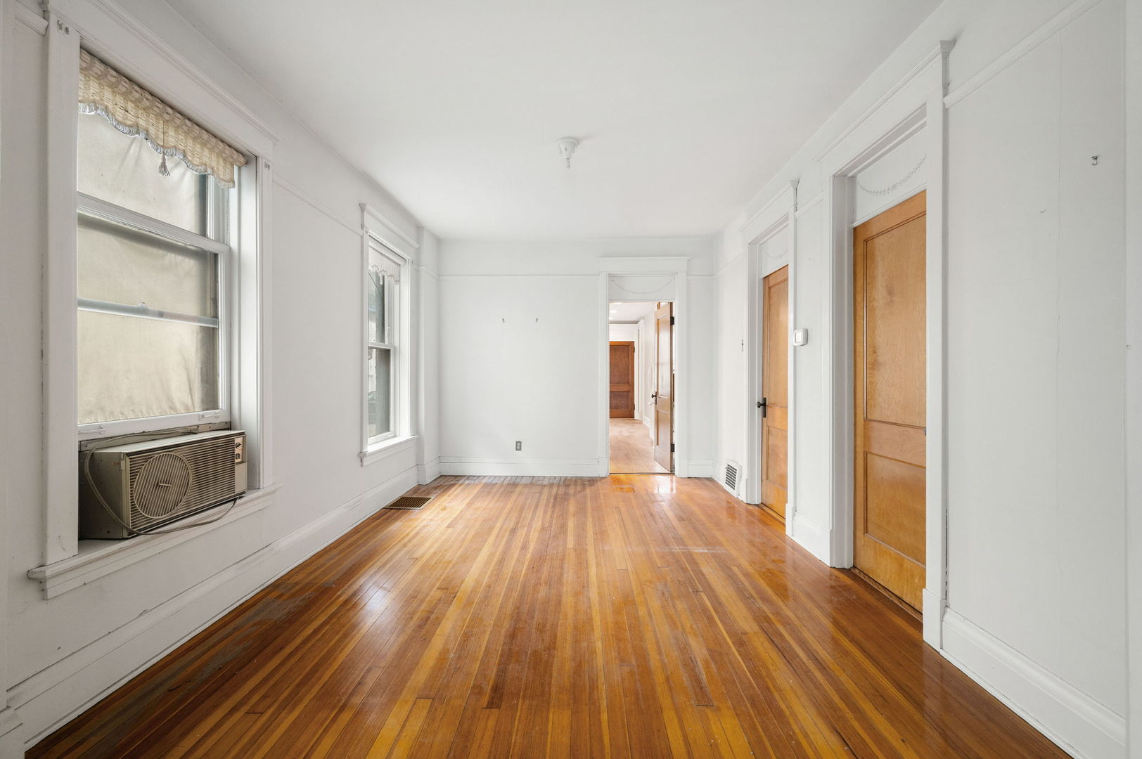1415 West George Street Chicago, IL 60657 - Photo 6 of 35 a view of a livingroom with wooden floor and window