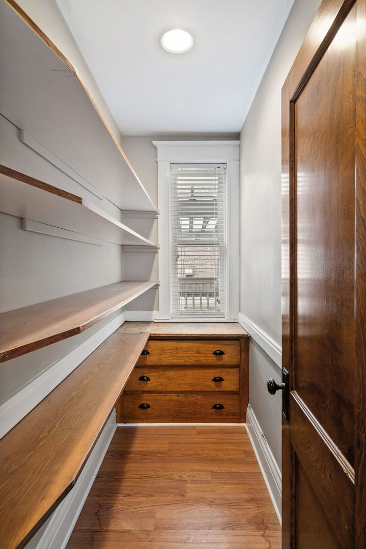 1415 West George Street Chicago, IL 60657 - Photo 9 of 35 a view of room with window and stairs