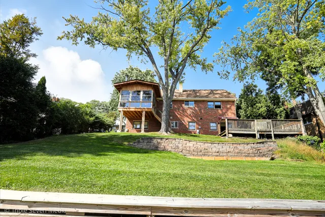 a view of wooden deck and a garden