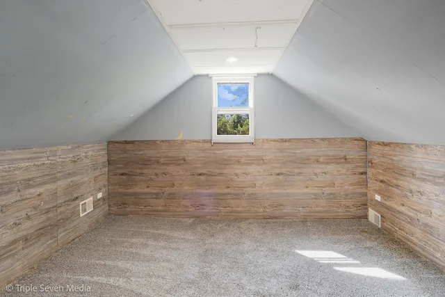 a kitchen with stainless steel appliances granite countertop a stove a refrigerator and a stove