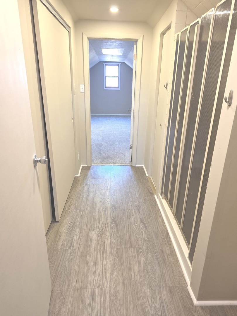 11307 German Church Road Willow Springs, IL 60480 - Photo 45 of 49 a view of a hallway with wooden floor and stairs