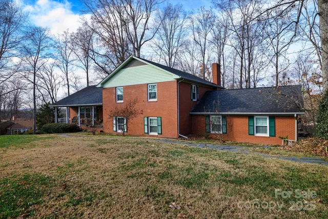 a view of a backyard with sitting area
