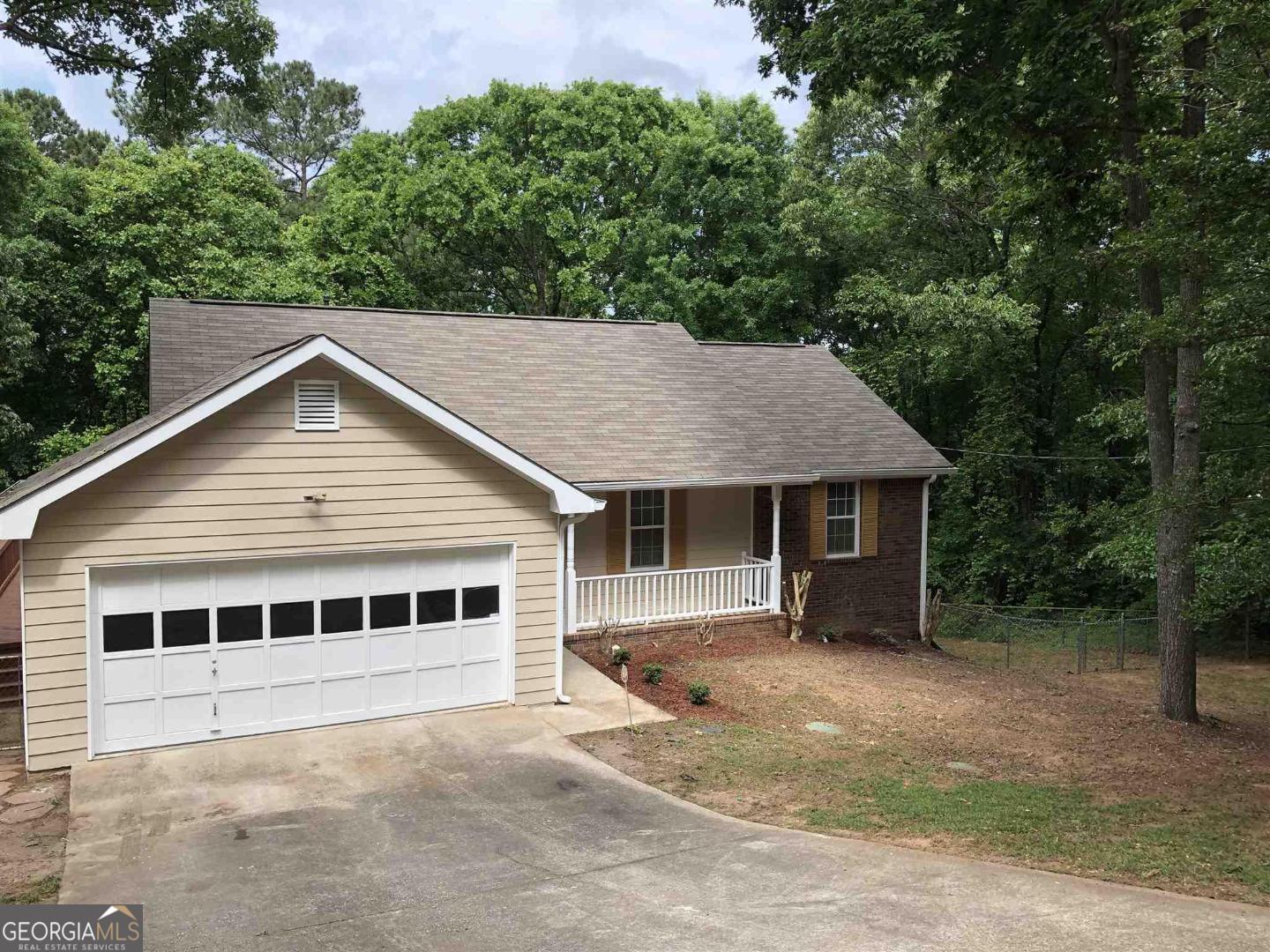 217 Briarpatch Court Stockbridge, GA 30281 - Photo 1 of 1 a house with trees in the background