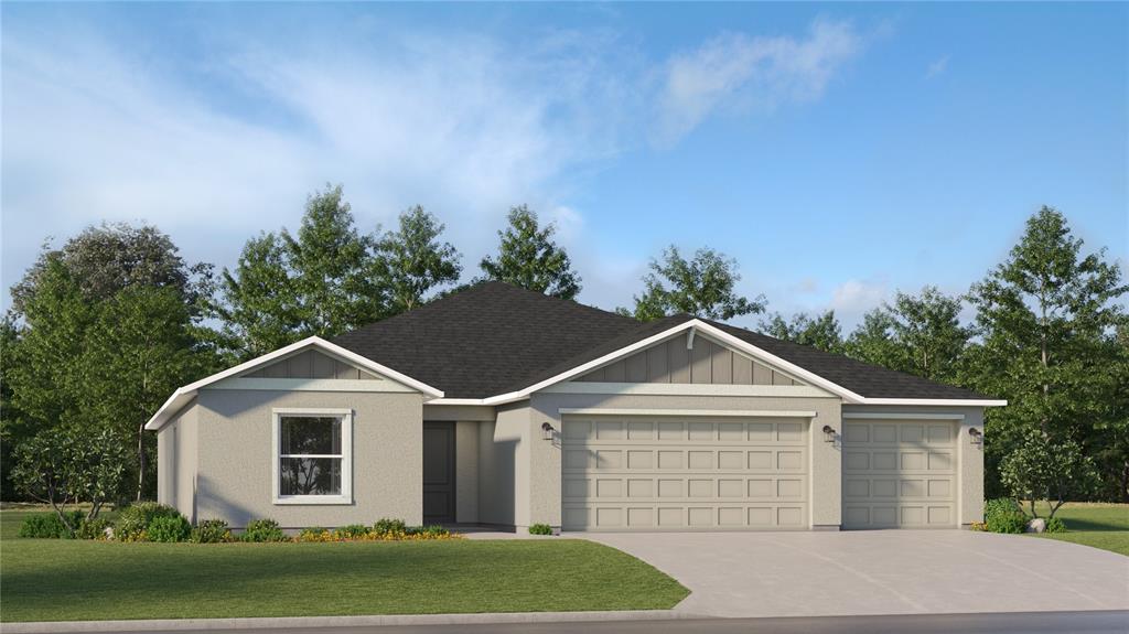 8312 Southwest 42nd Circle Ocala, FL 34476 - Photo 1 of 2 a front view of a house with a yard and garage