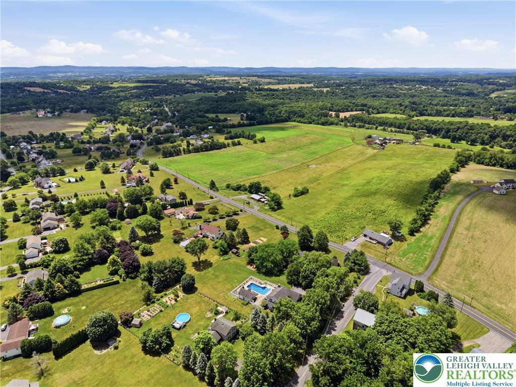 890 Lahr Road Nazareth, PA 18064 - Photo 60 of 71 Vast green fields and scattered homes define this idyllic countryside landscape.