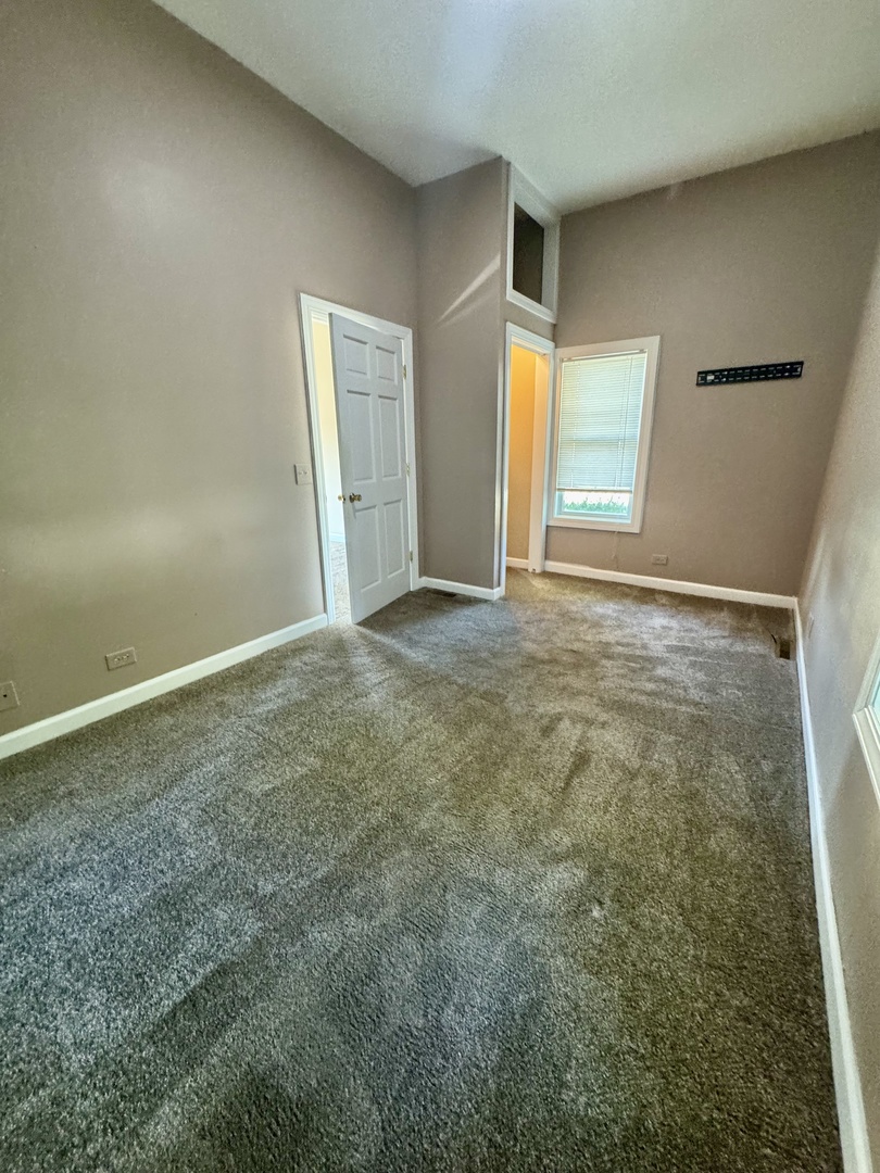 110 North Elm Street Waterman, IL 60556 - Photo 3 of 16 a view of an empty room and window