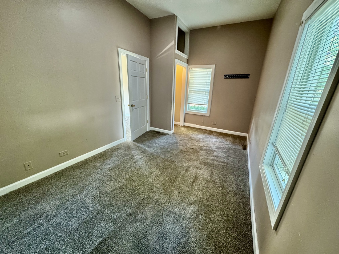 110 North Elm Street Waterman, IL 60556 - Photo 4 of 16 an empty room with windows and entrance