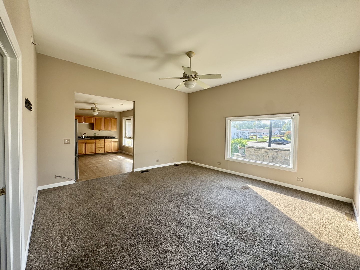 110 North Elm Street Waterman, IL 60556 - Photo 7 of 16 a view of an empty room with a window