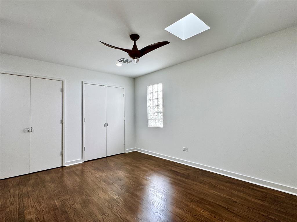 4134 Travis Street, Unit 2 Dallas, TX 75204 - Photo 13 of 28 a view of empty room with wooden floor