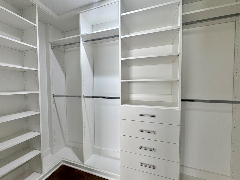 4134 Travis Street, Unit 2 Dallas, TX 75204 - Photo 14 of 28 a view of walk in closet with empty racks