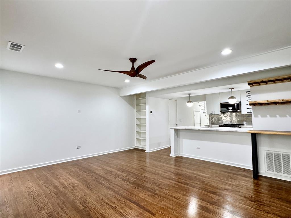 4134 Travis Street, Unit 2 Dallas, TX 75204 - Photo 2 of 28 a view of kitchen with wooden floor and window