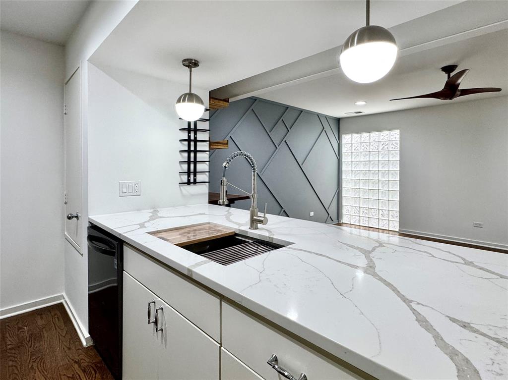4134 Travis Street, Unit 2 Dallas, TX 75204 - Photo 4 of 28 a kitchen with a sink and a stove