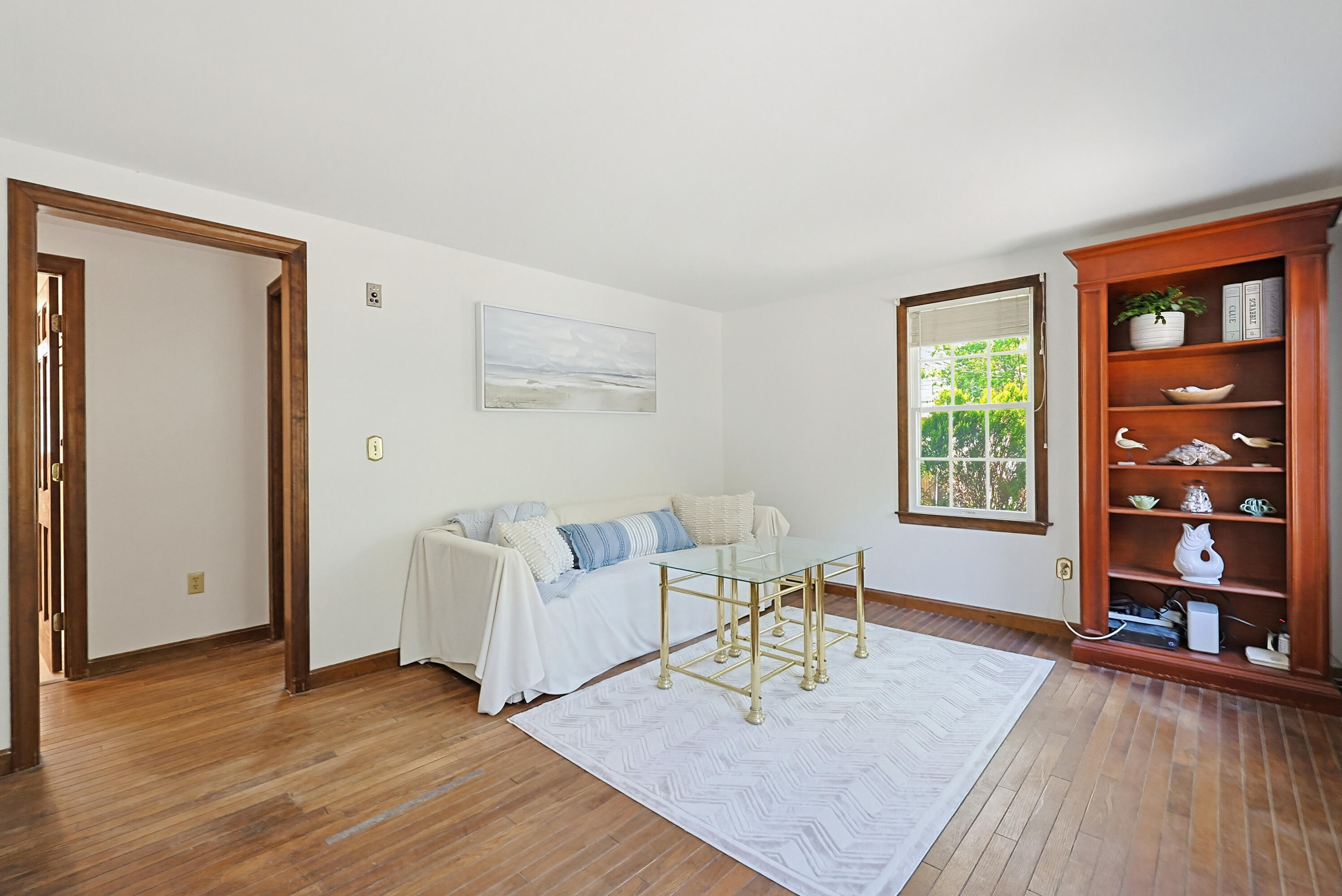 556 Cotuit Road Mashpee, MA 02649 - Photo 7 of 45 a living room with furniture and wooden floor