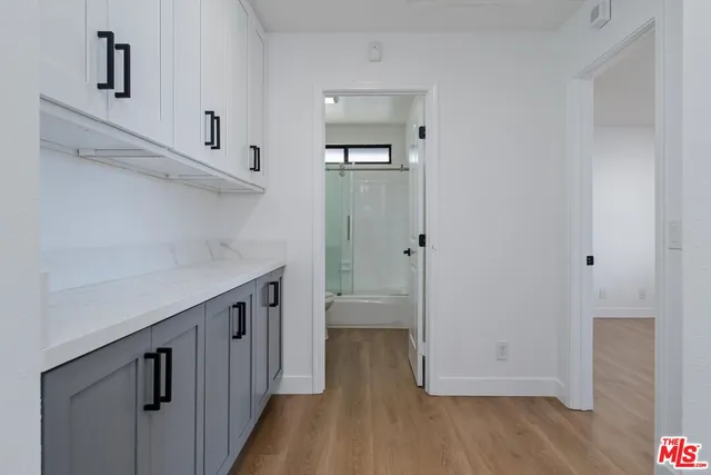 a view of hallway with wooden floor