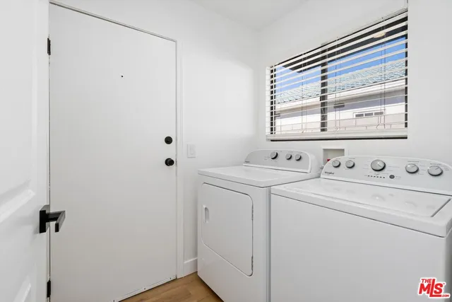 a view of bathroom with a washer and dryer