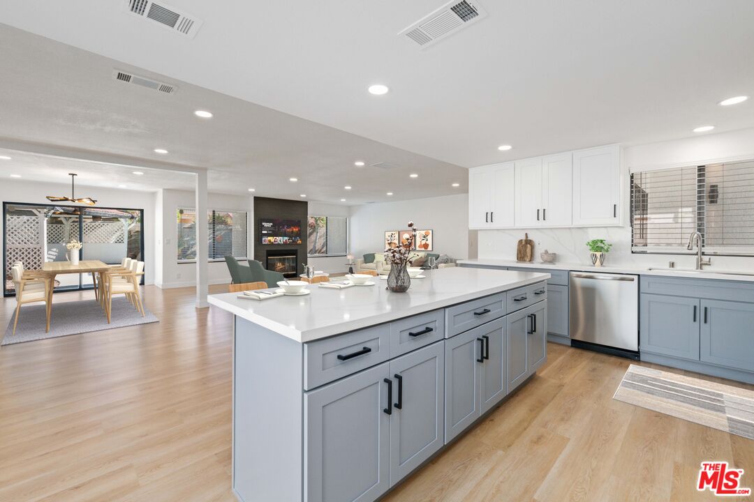 67350 Medano Road Cathedral City, CA 92234 - Photo 7 of 20 a kitchen with sink stove and cabinets