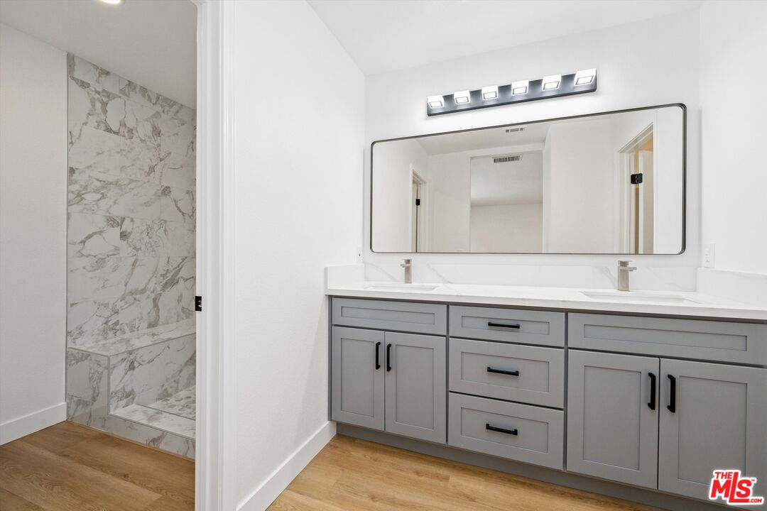 67350 Medano Road Cathedral City, CA 92234 - Photo 9 of 20 a bathroom with a double vanity sink mirror and