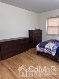 44 Judson Street, Unit 9A Edison, NJ 08837 - Photo 4 of 12 a bedroom with a bed and window