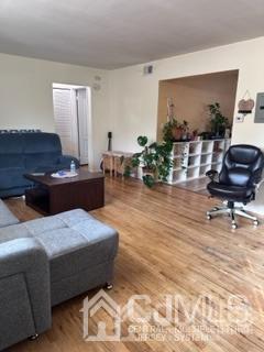 44 Judson Street, Unit 9A Edison, NJ 08837 - Photo 8 of 12 a living room with furniture and wooden floor